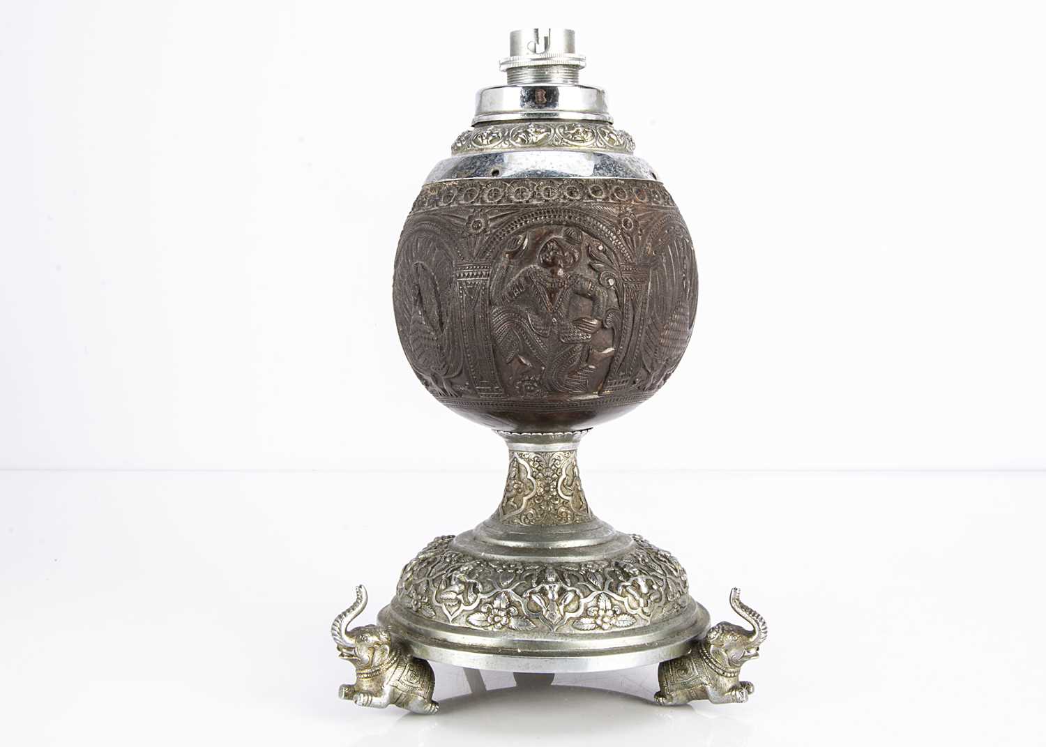 Lot 476 - A c1930s Indian carved coconut and silver plated table lamp