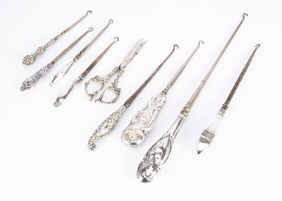 Lot 481 - Eight Victorian and later silver handled button hooks