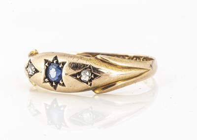 Lot 45 - A 15ct gold sapphire and diamonds three stone gypsy set dress ring