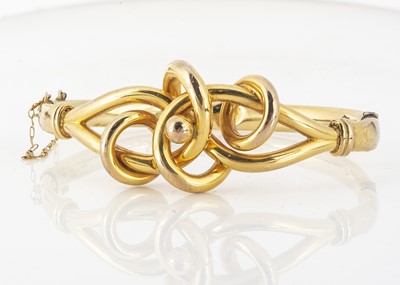 Lot 46 - An early 20th Century yellow metal knot bangle