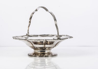 Lot 498 - A George III silver swing handled centre piece dish by CP