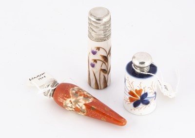 Lot 528 - Three Victorian and later ceramic and silver capped scent bottles