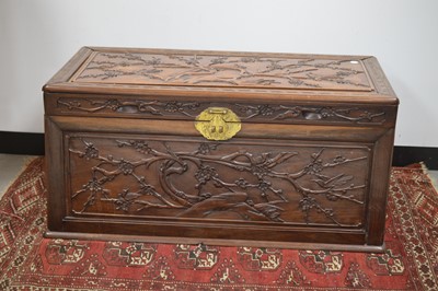 Lot 21 - A Chinese carved camphor wood chest