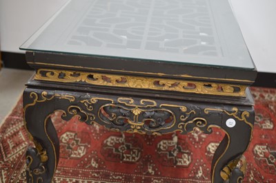 Lot 23 - A Chinese style black lacquer and gilt wood coffee table 