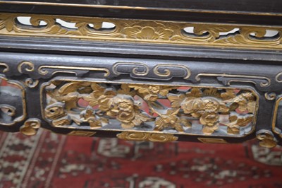 Lot 23 - A Chinese style black lacquer and gilt wood coffee table 