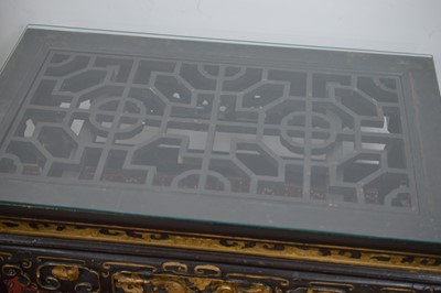 Lot 23 - A Chinese style black lacquer and gilt wood coffee table 