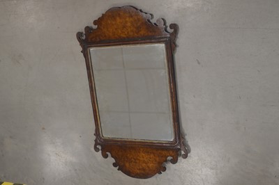 Lot 35 - A George II style walnut fret cut wall mirror