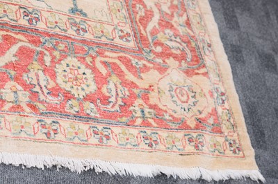 Lot 44 - An antique Turkish Ushak carpet with ivory coloured wool ground