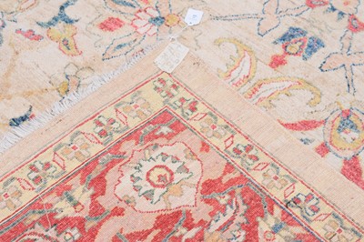 Lot 44 - An antique Turkish Ushak carpet with ivory coloured wool ground