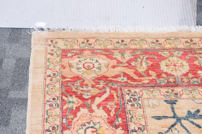Lot 44 - An antique Turkish Ushak carpet with ivory coloured wool ground