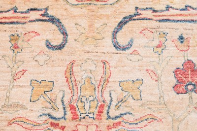 Lot 44 - An antique Turkish Ushak carpet with ivory coloured wool ground