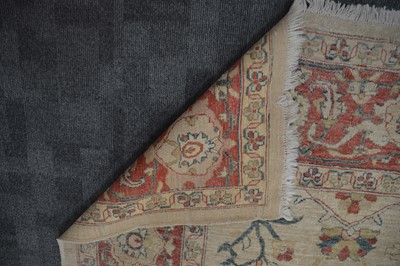 Lot 44 - An antique Turkish Ushak carpet with ivory coloured wool ground