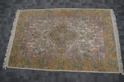 Lot 53 - An abstract floral design gold ground Persian carpet