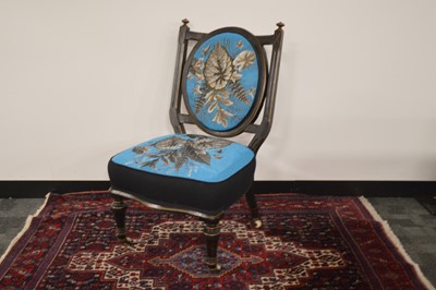 Lot 70 - A Victorian Aesthetic Movement ebonized nursing seat English circa 1870s