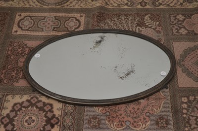 Lot 97 - An oval wall mirror