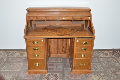 Lot 100 - A 20th Century Art Deco period oak roll-topped desk