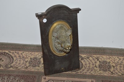 Lot 108 - A Victorian brass boar head wall mounted crop rack