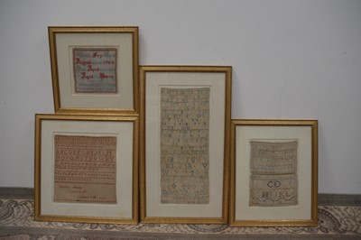 Lot 299 - A group of four 18th and 19th Century needlework samplers