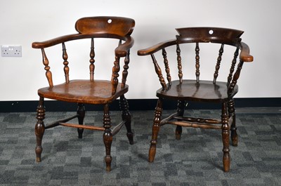 Lot 554 - An early 20th century yew and elm captains chair