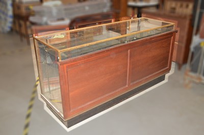 Lot 557 - An Edwardian brass oak framed, glazed shop counter display cabinet