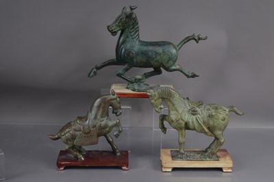 Lot 337 - Three modern bronze horse sculptures after Chinese archaistic originals