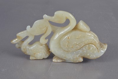 Lot 350 - A Chinese jade carving of a swan and signet with a lotus pod