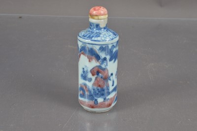 Lot 379 - A Qing Chinese blue and white with underglaze-red snuff bottle