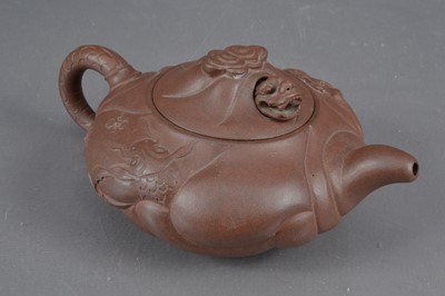 Lot 380 - A Chinese Yixing clay teapot with articulated dragon lid