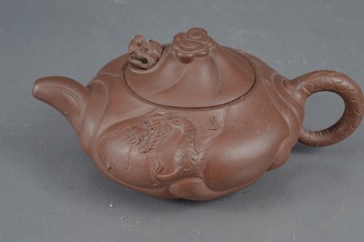 Lot 380 - A Chinese Yixing clay teapot with articulated dragon lid