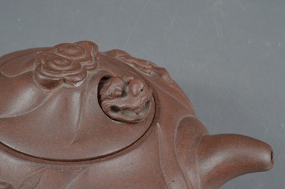Lot 380 - A Chinese Yixing clay teapot with articulated dragon lid