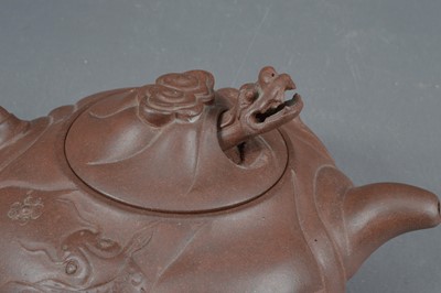 Lot 380 - A Chinese Yixing clay teapot with articulated dragon lid
