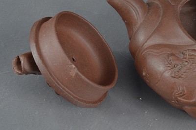 Lot 380 - A Chinese Yixing clay teapot with articulated dragon lid