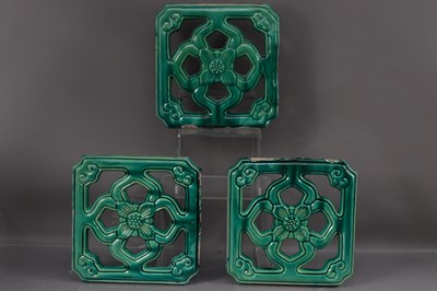 Lot 385 - Three antique Chinese green glaze 'breezeway' tiles