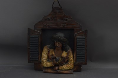 Lot 403 - An unusual late 19th Century painted terracotta wall plaque of a musician at a window