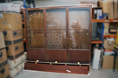 Lot 563 - A large oak veneered and glazed triple display cabinet