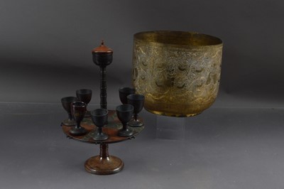 Lot 411 - A 19th century revolving treen egg cup stand