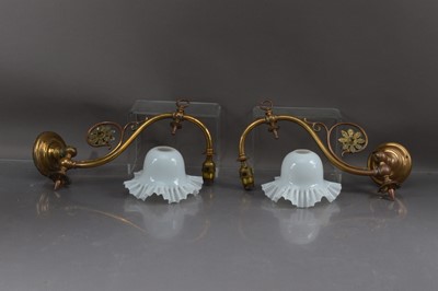 Lot 417 - A pair of Arts and Crafts period brass adjustable wall lights