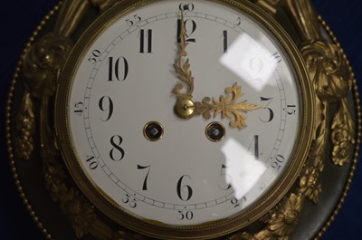 Lot 446 - A French Empire style gilt bronze cartel clock