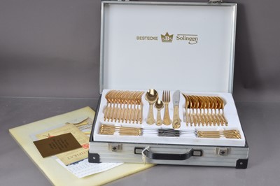 Lot 500 - A Bestecke Solingen gold-plated twelve-place cutlery set in fitted flight-case.