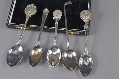 Lot 504 - A collection of five sliver golf related coffee spoons