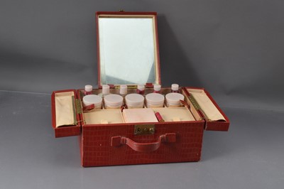 Lot 553 - An original Elizabeth Arden New York red leatherette fitted vanity case