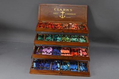 Lot 557 - An antique oak haberdasher's box for Clark's "Anchor" Soft Embroidery threads