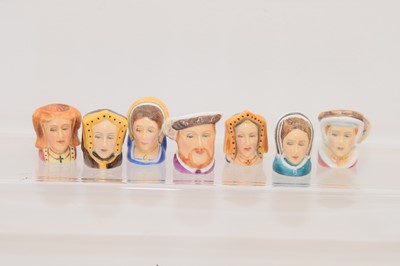 Lot 561 - A set of seven novelty Staffordshire porcelain thimbles