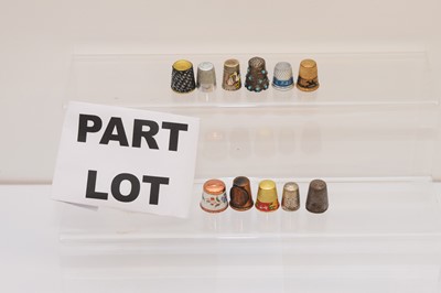 Lot 564 - A collection of metal thimbles