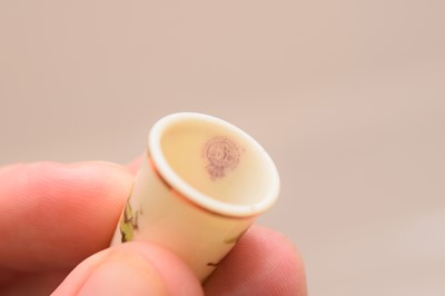 Lot 565 - Two Royal Worcester porcelain thimbles and another
