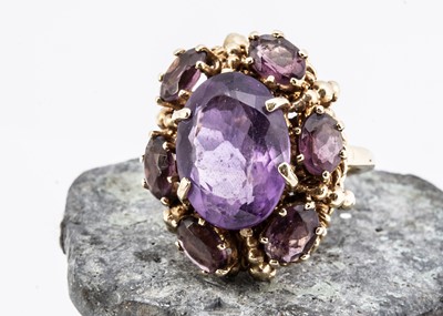 Lot 8 - A Middle Eastern amethyst and paste set dress ring