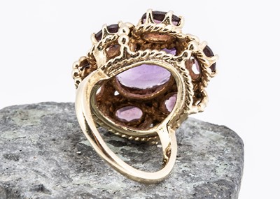Lot 8 - A Middle Eastern amethyst and paste set dress ring
