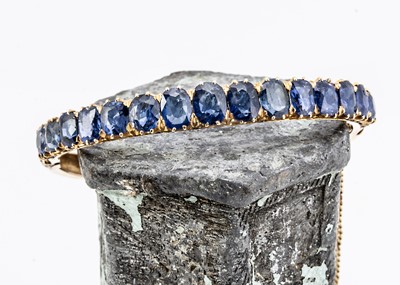 Lot 15 - A nice gold and sapphire bangle