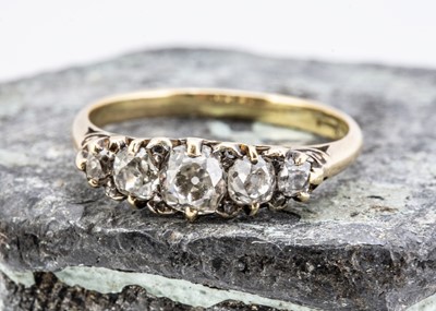 Lot 28 - An Edwardian five stone diamond dress ring