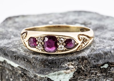 Lot 30 - A seven stone ruby and diamond dress ring